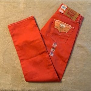 Brand new shrink to fit Levi’s 501. Color is more of a coral than red